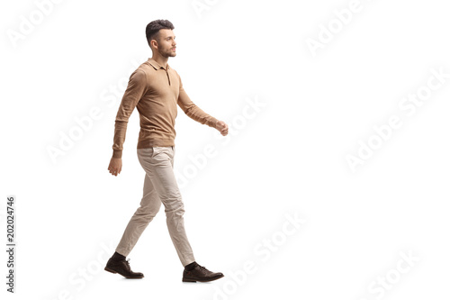 Young man walking photo