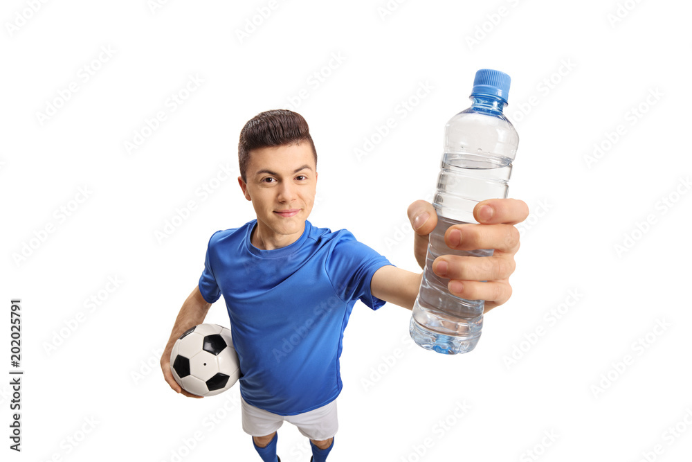 Φωτογραφία Teenage soccer player with a football and a bottle of water