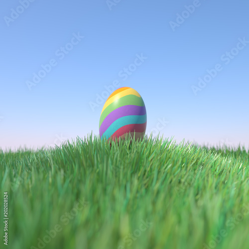 Easter Egg Rainbow colored on green grass hill, 3D Rendering