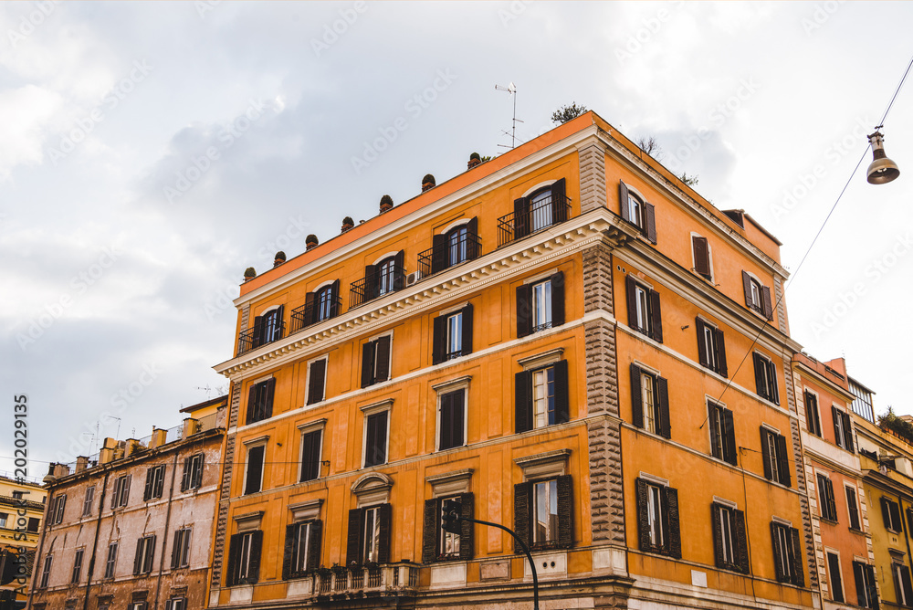bottom view of orange buildings in Rome, Italy