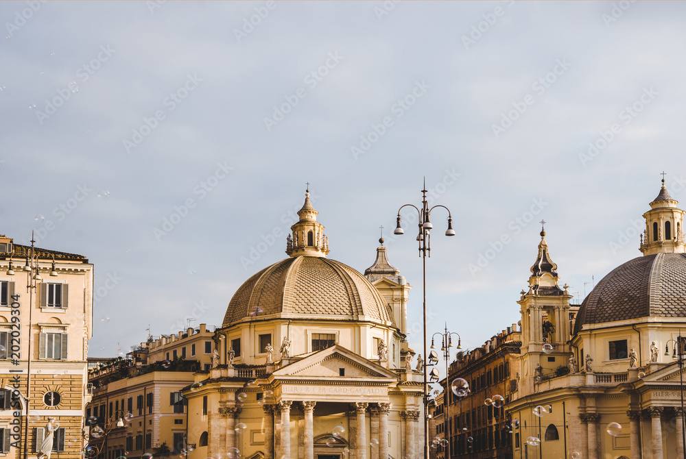 Obraz premium St Maria in Montesanto and St Maria Miracoli churches at piazza del popolo (peoples square) in Rome, Italy