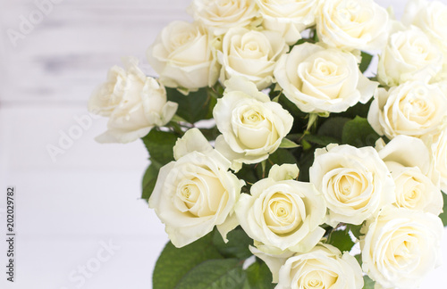 Bouquet of white roses in a vase. Bouquet of chic white roses