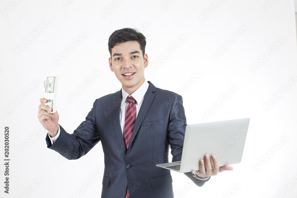 Asian Businessman standing and holding laptop and money on White Background with Success feeling, Business Success Concept, isolated on white background. Asian Businessman standing and holding laptop and money on White Background with Success feeling, Business Success Concept, isolated on white background.