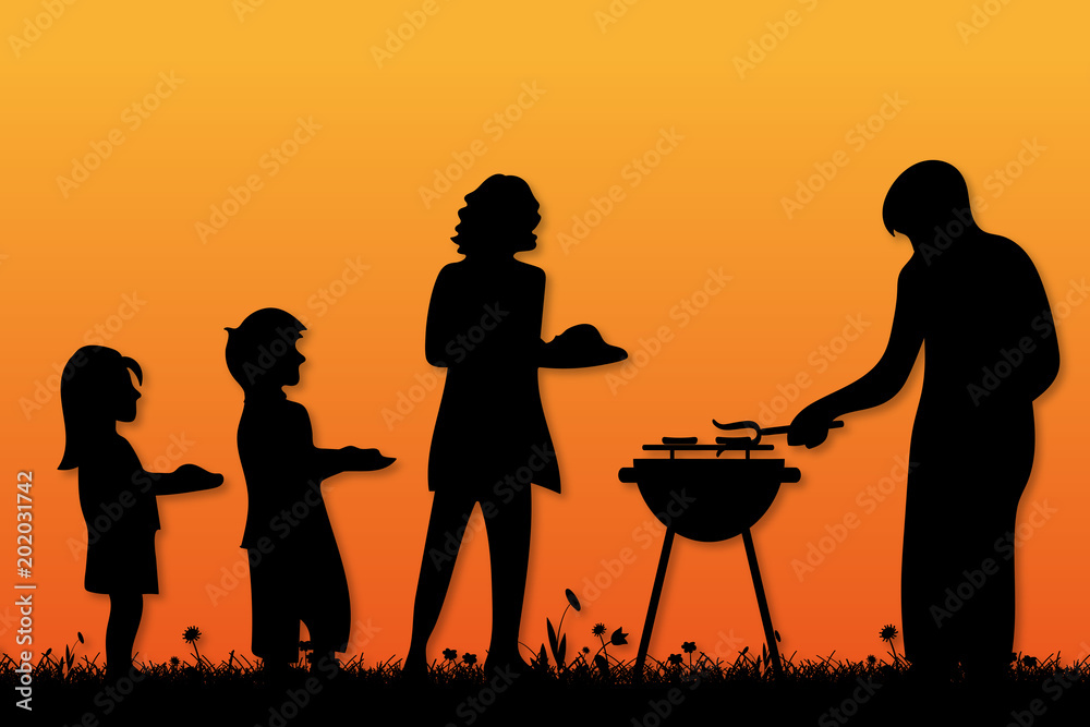 Familie grillt bei Sonnenuntergang