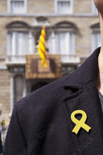 man with a yellow ribbon in Barcelona, Spain.