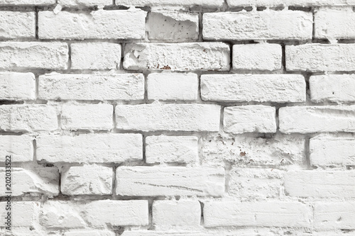 Niveous background of white painted old brick wall