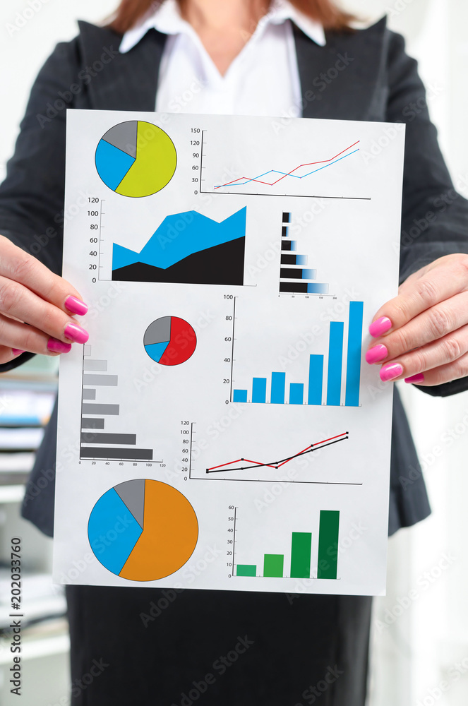 Graphical analysis concept shown by a businesswoman Graphical analysis concept shown by a businesswoman