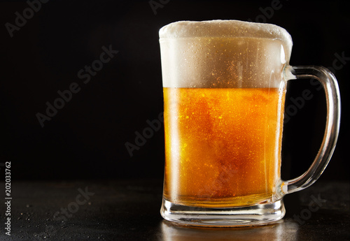 Large glass mug of effervescent chilled glitter or glitzer beer
