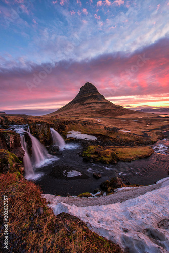 Spectacular sky above the scenery and waterfalls  Kirkjufell Mountain  Iceland.