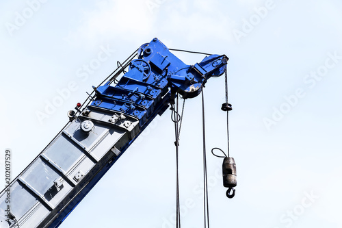Heavy construction blue crane for heavy liftin photo