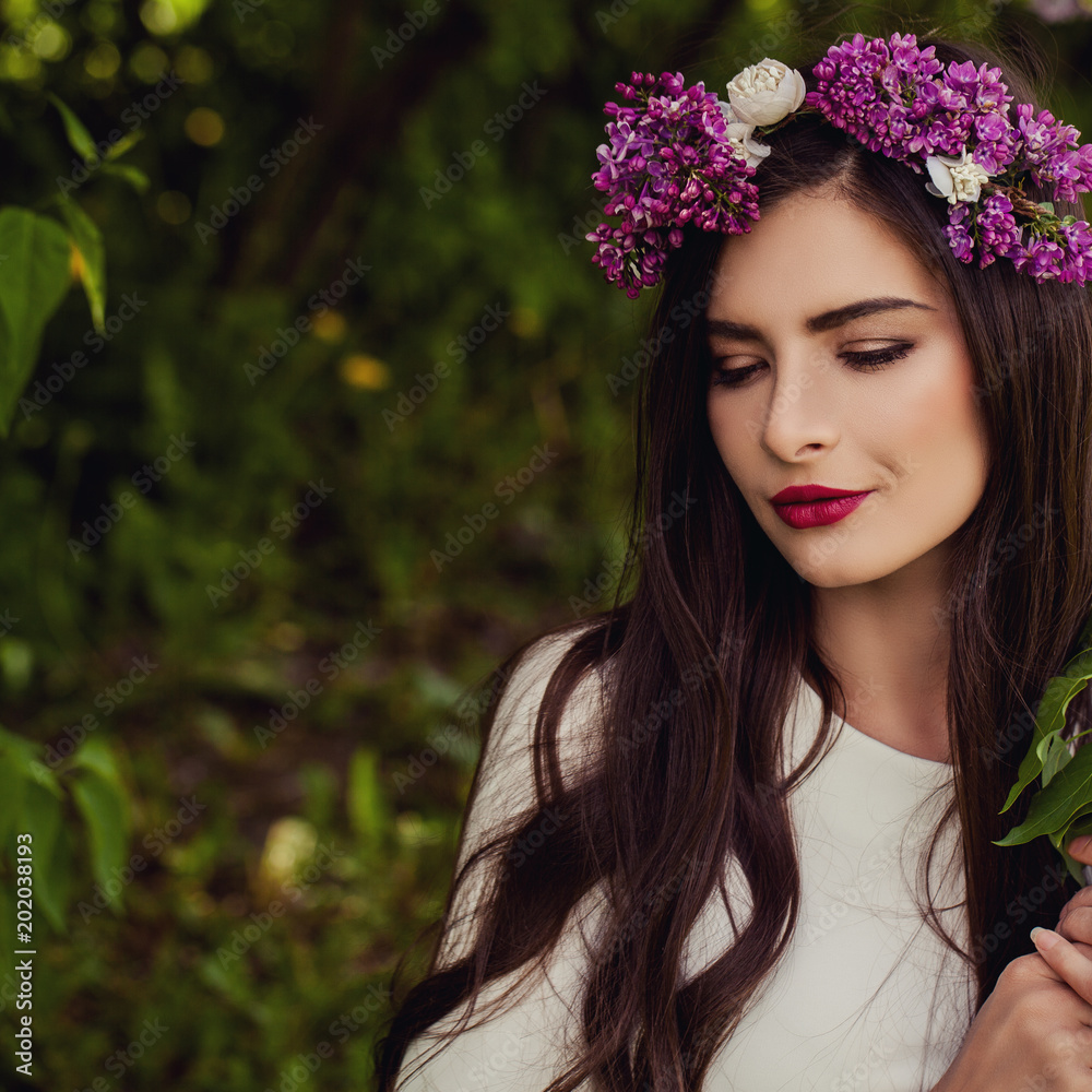 Beautiful Woman with Flowers Wreath Outdoor Summer Portrait on Natural Soft Focus Background with Copy space Beautiful Woman with Flowers Wreath Outdoor Summer Portrait on Natural Soft Focus Background with Copy space