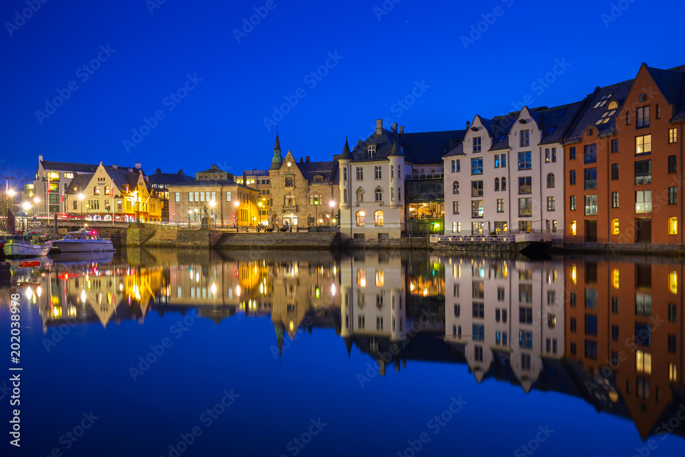 Architecture of Alesund town at night in Norway