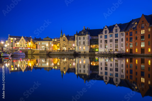 Architecture of Alesund town at night in Norway