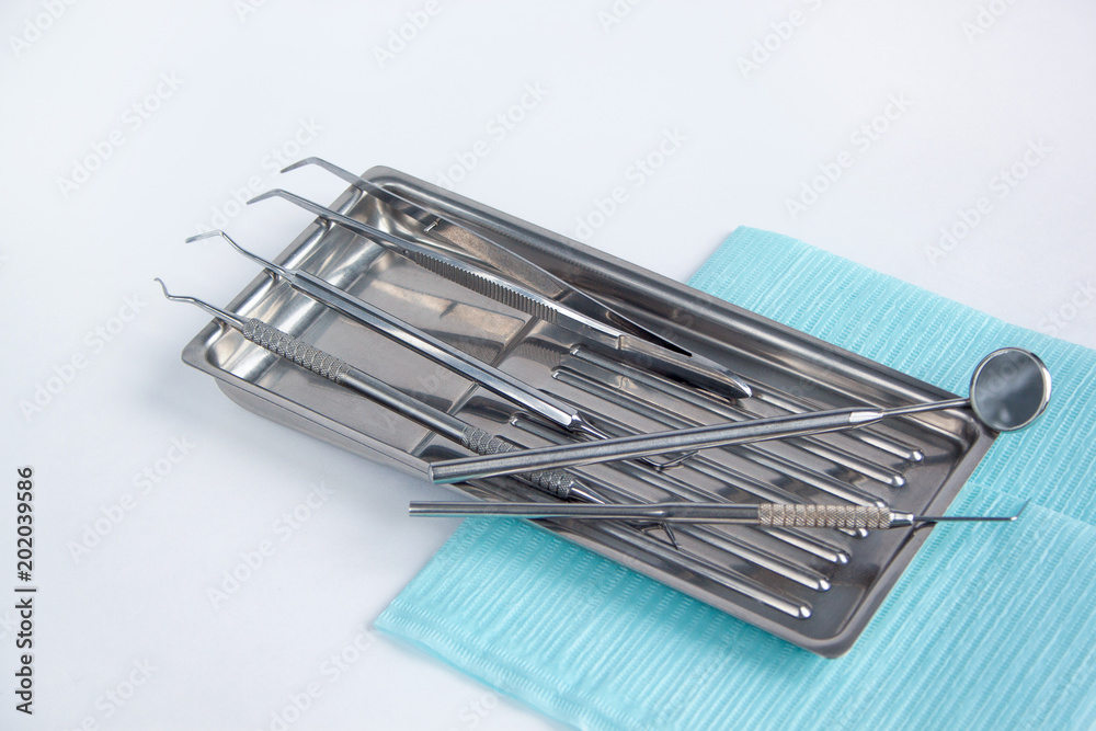 Group of dental tools and accessories for dental treatment. Isolated on white background.