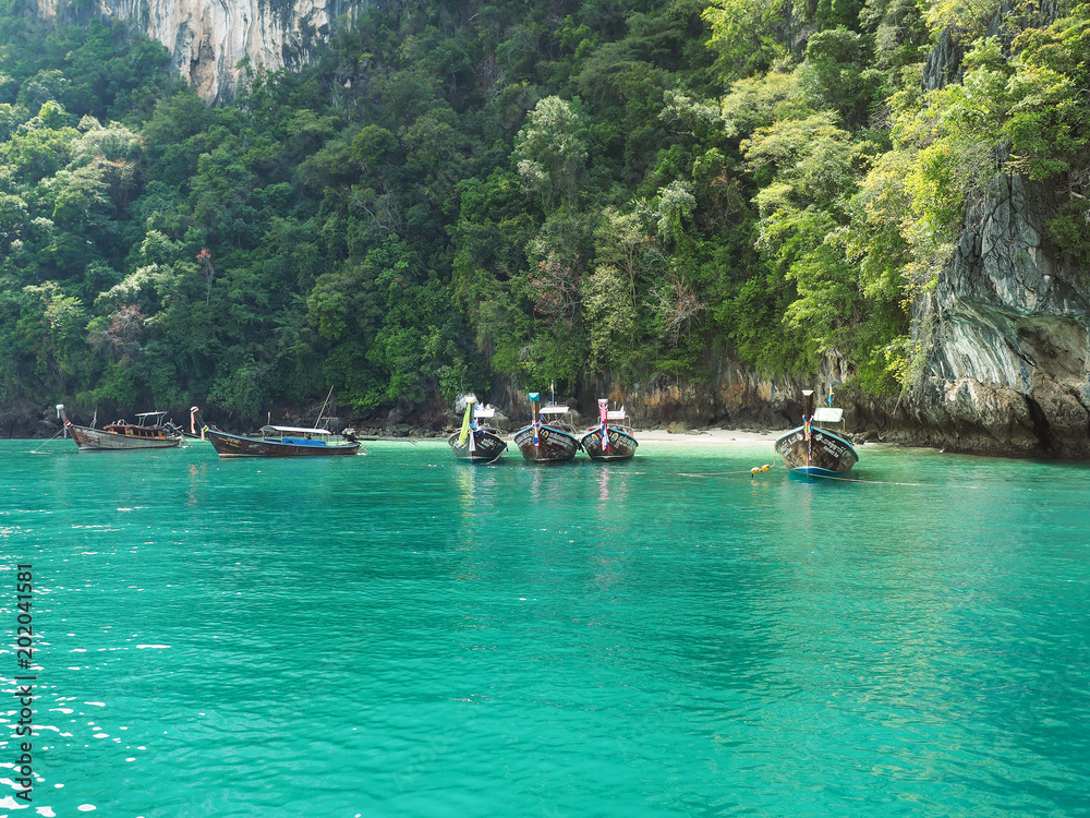 Emerald water and longtail boats near Hong island, Phang Nga National Park, Krabi