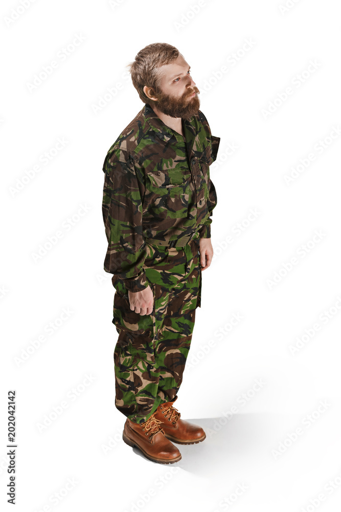 Young army soldier wearing camouflage uniform isolated on white Young army soldier wearing camouflage uniform isolated on white