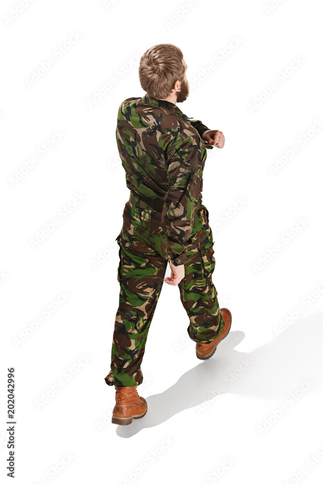 Young army soldier wearing camouflage uniform isolated on white Young army soldier wearing camouflage uniform isolated on white