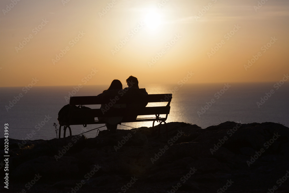 romantic couple silhouette at sunset
