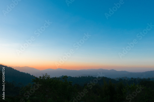 Colorful sky at sunrise with mountain  background