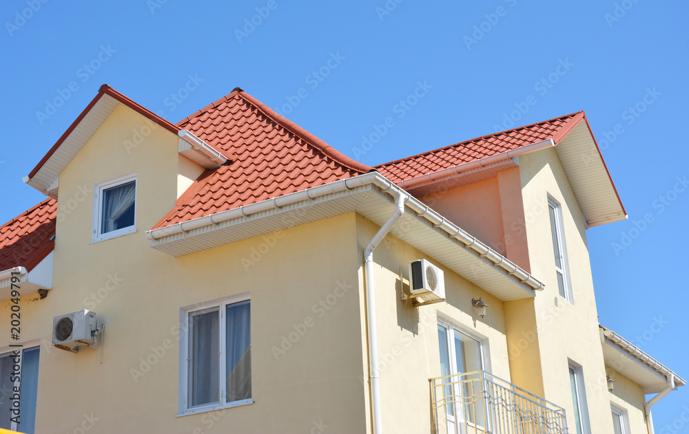 Close up on house attic roof guttering pipeline system problem area. Installing and repair roof gutter. Close up on house attic roof guttering pipeline system problem area. Installing and repair roof gutter.