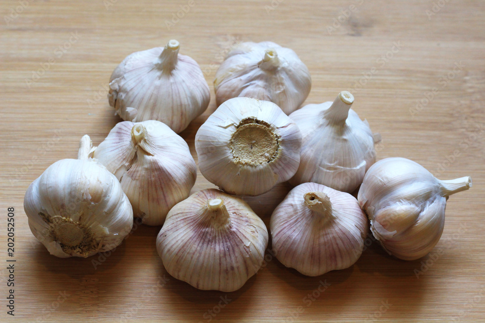 Garlic for cooking on wooden floor Garlic for cooking on wooden floor