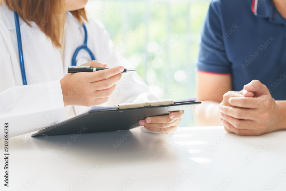Doctor and patient are discussing something, medical diagnosis concept Doctor and patient are discussing something, medical diagnosis concept