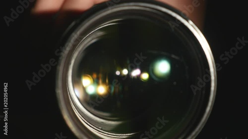 Video camera lens, showing zoom and glare, turns, close up