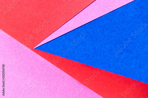 Pink, red and blue color paper display as abstract blank background