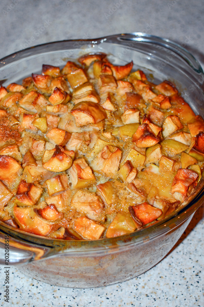 Fresh hot apple pie in glass bakeware, delicious homemade sweet dessert from oven Fresh hot apple pie in glass bakeware, delicious homemade sweet dessert from oven