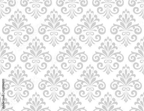 Wallpaper in the style of Baroque. A seamless vector background. White and grey floral ornament. Graphic vector pattern.