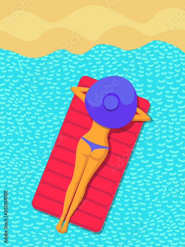 slender girl in swimsuit and hat lies on mattress in sea at beach