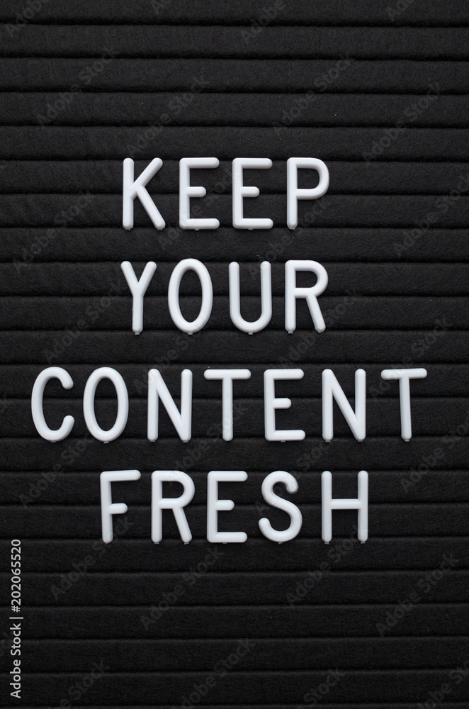 The phrase Keep Your Content Fresh in white plastic letters on a letter board as a reminder to update your marketing and social media platforms