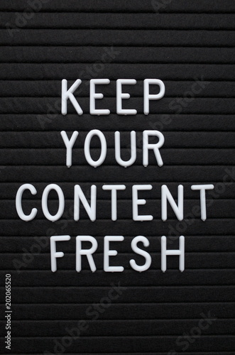The phrase Keep Your Content Fresh in white plastic letters on a letter board as a reminder to update your marketing and social media platforms