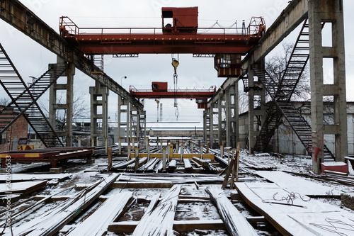 Abandoned old factory with bridge crane