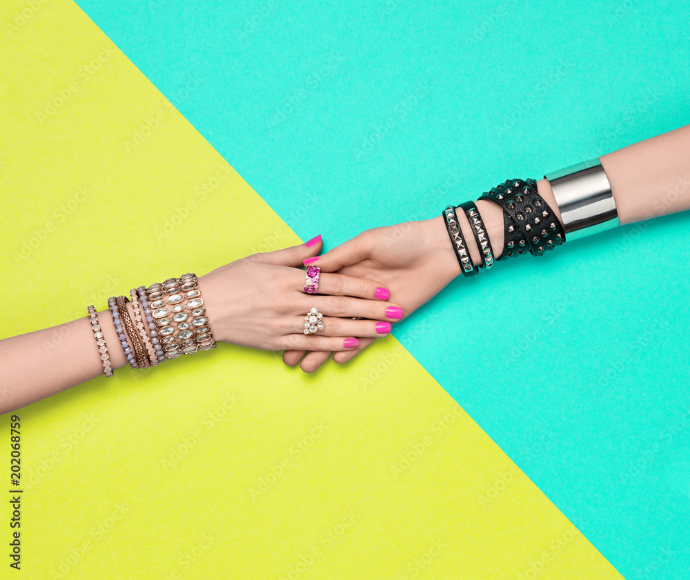 Fashion. Female hand, Stylish Trendy Jewelry. Minimal Design. Accessories  Set. Glamor bracelets Ring. Summer Hipster Girl Essentials. Creative Art.  Handshake Friendship concept Photos