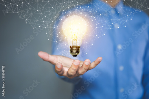 Light bulb, Innovative idea in the hand of businessman.
