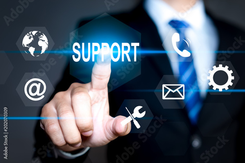 Businessman pressing button on virtual screens Technical support. Customer help. Business and technology concept
