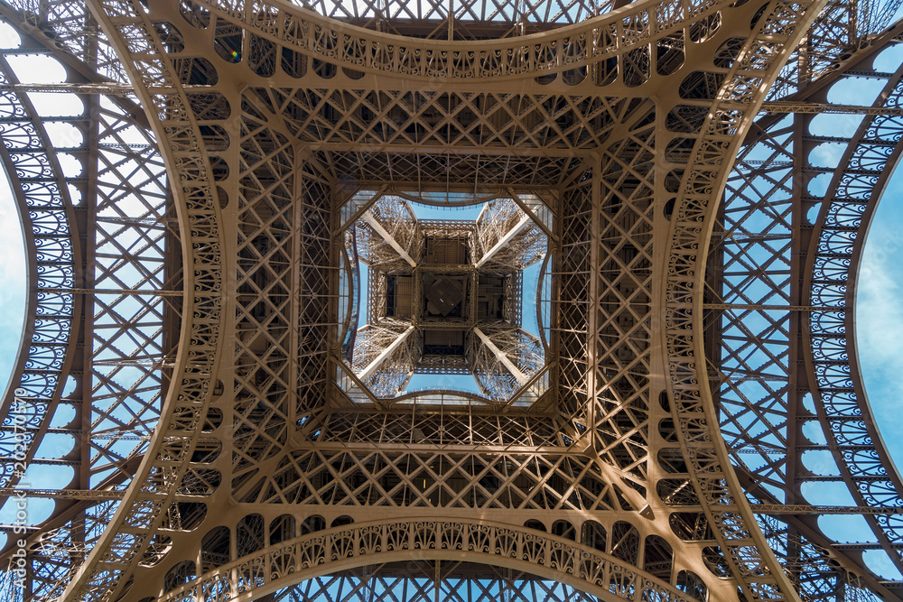 POV from under the Eiffel tower centar in Paris, France