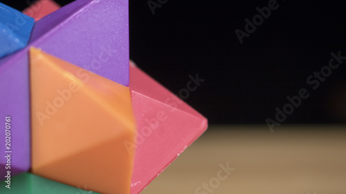 Close up of a geometric toy that is colorful