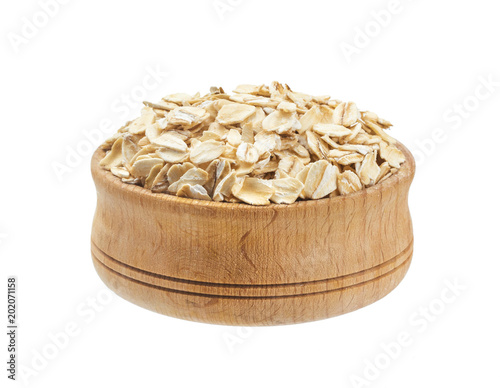 Oat flakes in bowl isolated on white background