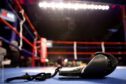 Boxing gloves in boxing ring