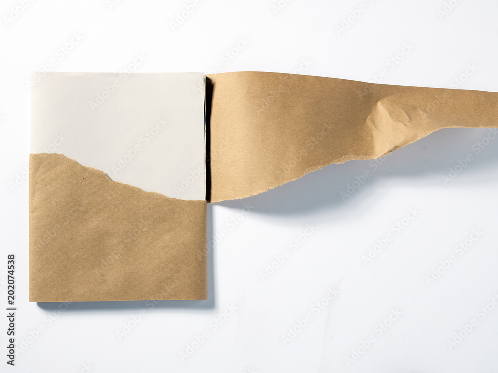 Stack of white paper in peeled brown wrapper Stack of white paper in peeled brown wrapper