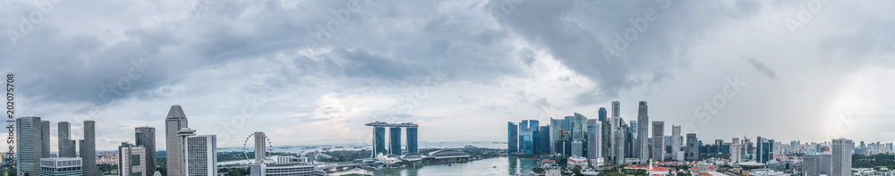 Aerial view panorama of Singapore skyscrapers with city skyline during cloudy summer day