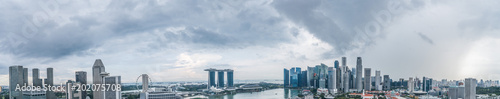 Aerial view panorama of Singapore skyscrapers with city skyline during cloudy summer day