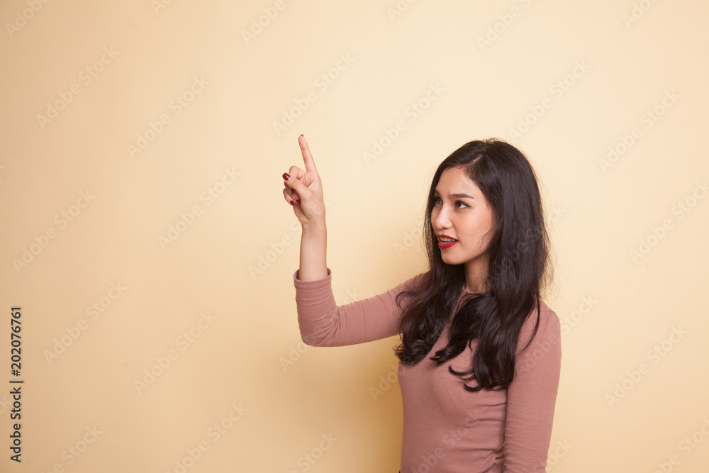Asian woman touching the screen with finger. Asian woman touching the screen with finger.