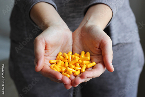 a handful of pills in female hands. Concept of health. 