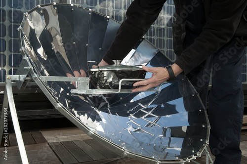 cooking in solar cooker photo