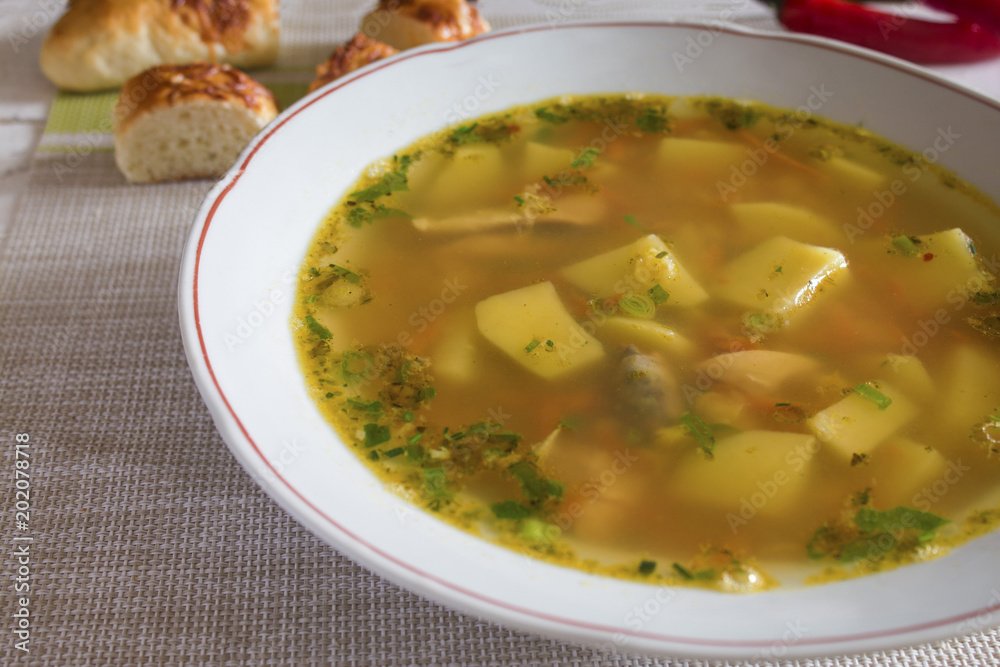 light transparent broth pea soup in a bowl light transparent broth pea soup in a bowl