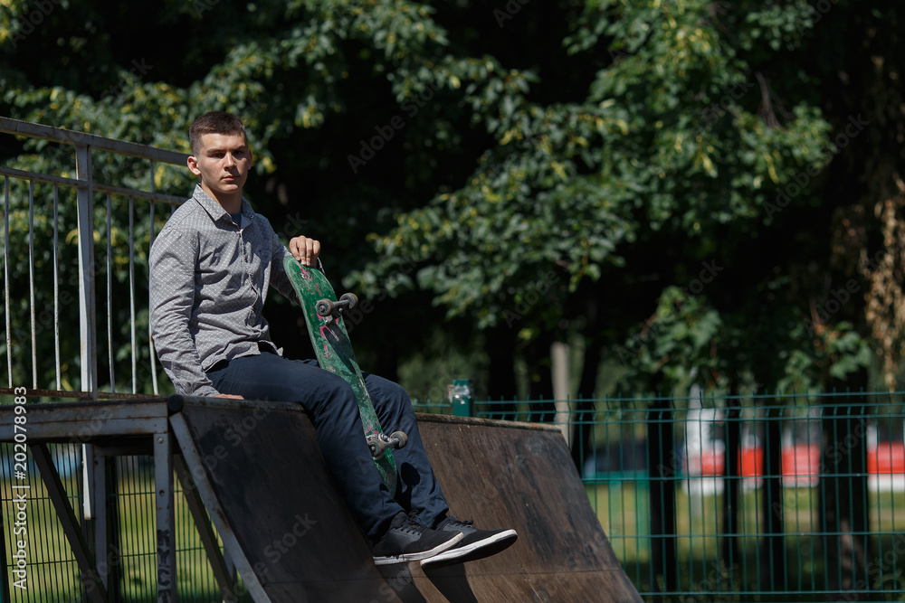 Fototapeta premium Young boy skater in the park