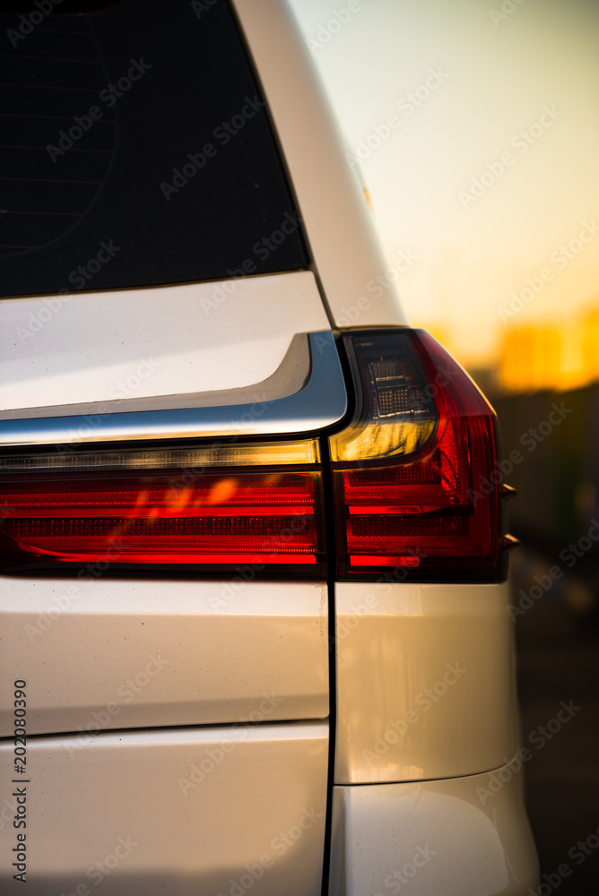 luxury white car rear lamp. sunlight luxury white car rear lamp. sunlight
